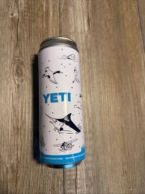 Yeti Slim Stash Can featuring a white outdoor adventure graphic